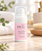 EMsana Augencreme Naturkosmetik auf hellem Naturstein in einem freundlichen Spa-Ambiente mit weichen Handtüchern und grünen Pflanzen.