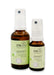 EMsana Zahnfit Spray in 20 ml und 50 ml, zwei braune Glasflaschen mit weißem Sprühkopf und hellgrünem Etikett, freigestellt vor weißem Hintergrund.