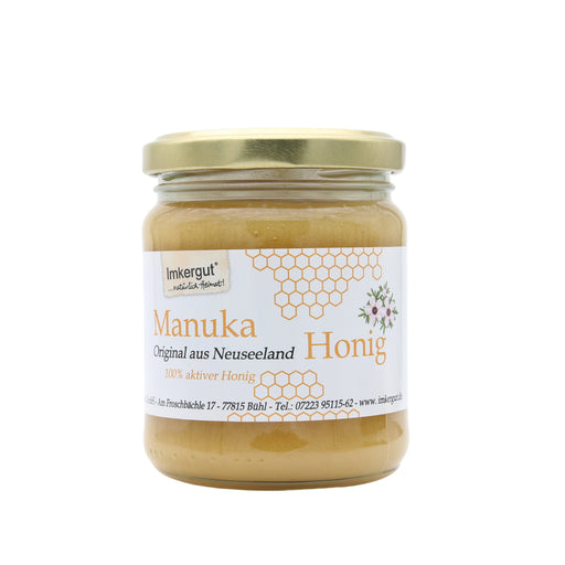 Imkergut Manuka Honig 250 g aus Neuseeland im Glas mit goldenem Schraubdeckel und weißem Etikett mit Wabenmotiv, freigestellt vor weißem Hintergrund.