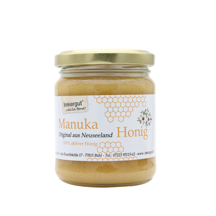 Imkergut Manuka Honig 250 g aus Neuseeland im Glas mit goldenem Schraubdeckel und weißem Etikett mit Wabenmotiv, freigestellt vor weißem Hintergrund.