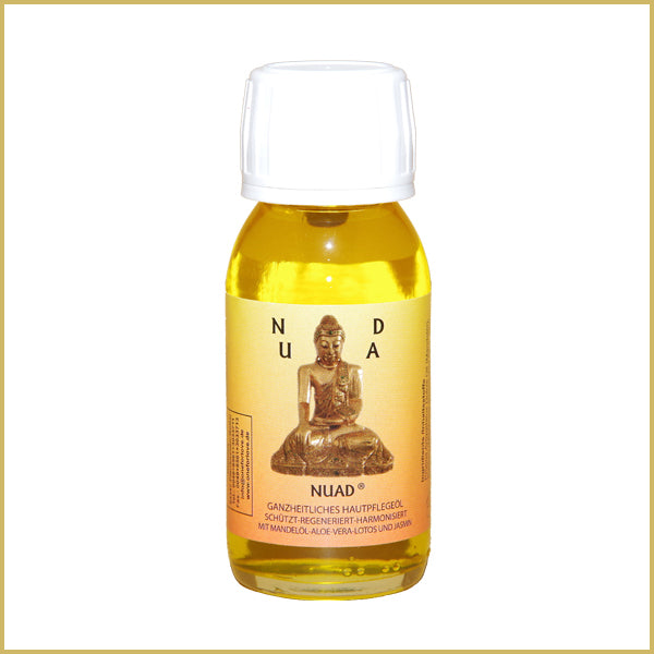 NUAD Öl ganzheitliches naturreines Hautpflegeöl in 60-ml-Flasche mit weißem Verschluss und goldgelbem Pflegeöl vor hellem Hintergrund.