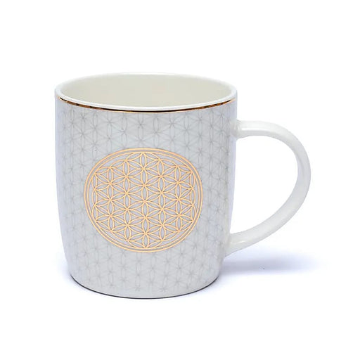 Helle Teetasse mit goldfarbenem Motiv Blume des Lebens