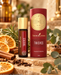 Young Living Thieves Essential Oil Roll-On 10 ml mit Originalverpackung, umgeben von getrockneten Orangenscheiben, Zimtstangen, Nelken, Rosmarin und Eukalyptus in warmer natürlicher Produktinszenierung.