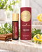 Young Living Thieves Essential Oil Roll-On 10 ml mit roter Originalverpackung, dekoriert mit Zitronenschale, Zimtstangen, Nelken, Rosmarin und frischen grünen Kräutern auf hellem Naturstein.