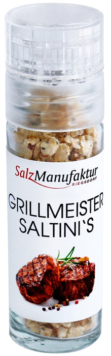 SalzManufaktur Siegsdorf Grillmeister Saltini's in einer kleinen, transparenten Gewürzmühle mit weißem Mahlwerk.