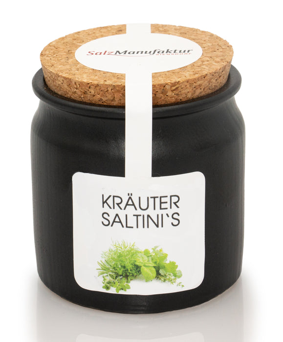 SalzManufaktur Siegsdorf Kräuter Saltini's im schwarzen Keramikgefäß mit naturbelassenem Korkdeckel und weißem Kräuteretikett.