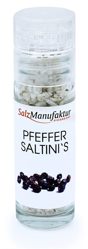 SalzManufaktur Siegsdorf Pfeffer Saltini's in einer kleinen, transparenten Gewürzmühle mit weißem Mahlwerk.
